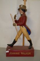 A Johnnie Walker bar advertising figure