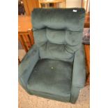 A green material covered recliner armchair (Item 53 on vendor list)