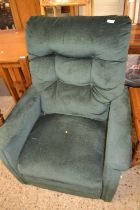 A green material covered recliner armchair (Item 53 on vendor list)