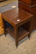 Small dark wood two tier table on wheels