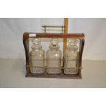 Victorian walnut and brass mounted tantalus (no key present and decanters chipped, no makers mark