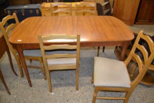 Mid Century teak dining table together with five associated chairs