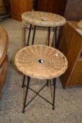 Two wicker and metal framed stools