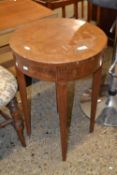 Continental circular occasional table on tapering legs