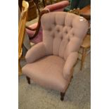 A Victorian style button back armchair