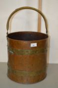 A copper and brass coal bucket