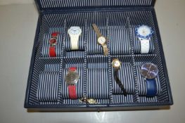 Display case of assorted wristwatches
