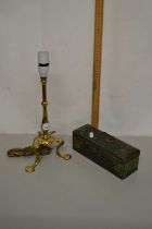 A brass stirrup type lamp together with a vintage tin