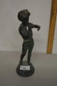 A bronzed metal model of a child