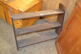 An oak three tier wall shelf, 83cm wide