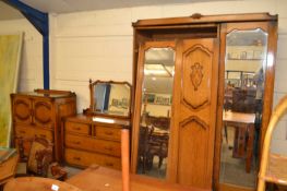 Early 20th Century three piece oak bedroom suite comprising a triple door wardrobe, tall boy cabinet