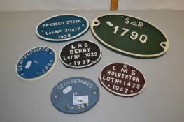 A group of six various small cast iron railway plaques to include LMS Derby, LMS Wolverton and