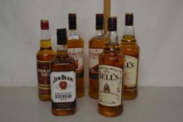 Six bottles of whisky comprising Bells, Jim Beam, Highland Early, Famous Grouse