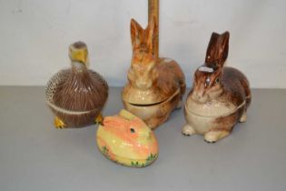 Group of four various rabbit and bird shaped storage boxes