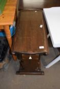 An oval drop leaf coffee table with small drawer