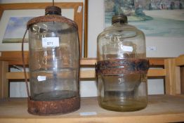 Two glass jars with metal mountings