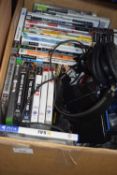 Broadband modem, headphones and a quantity of assorted PS2, PS3 and other games