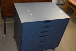 A small blue chest of drawers