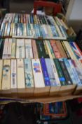 Two boxes of assorted paperback fiction to include thrillers and others