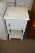 A white painted bedside cabinet