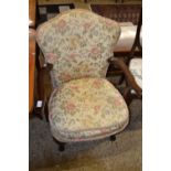 Small floral upholstered armchair on cabriole legs