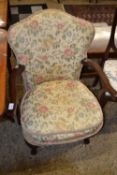 Small floral upholstered armchair on cabriole legs