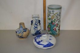 A group of reproduction Oriental ceramics comprising three vases and a covered blue and white bowl