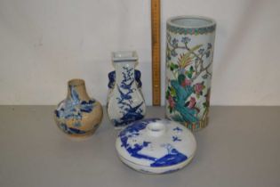 A group of reproduction Oriental ceramics comprising three vases and a covered blue and white bowl