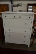 A modern white six drawer bedroom chest