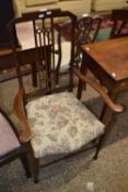 An Arts & Crafts style bedroom chair with floral upholstered seat