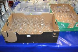 Three boxes of various clear drinking glasses, jugs etc