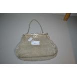 Mesh work evening bag with paste decoration