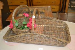 Two baskets and a quantity of fake flowers