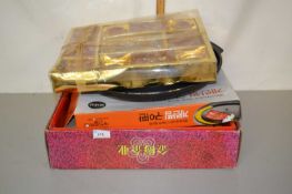 Boxed, as new Oriental tea set together with a further boxed candle set and a Korean cooking pan