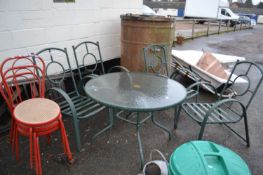 Circular metal framed garden table and four chairs together with three further metal framed chairs