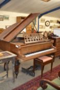 A Beulhoff baby grand piano with accompanying stool