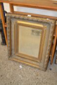 Rectangular bevelled wall mirror in a heavy moulded gilt finish frame