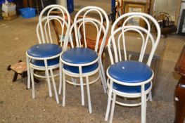 A set of six metal framed cafe type chairs with blue upholstered seats