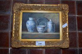 Modern still life study of blue and white ceramics, oil on board, gilt framed