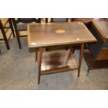 An Edwardian mahogany two tier occasional table