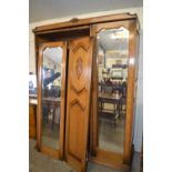 Early 20th Century three piece oak bedroom suite comprising a triple door wardrobe, tall boy cabinet