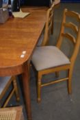 An extending dining table and five chairs