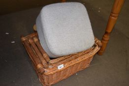 A set of three baskets and an upholstered footstool