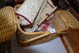 Wicker picnic basket and a quantity of needlework materials