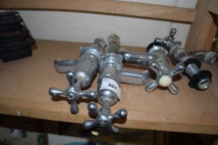 A group of four vintage chrome finish taps