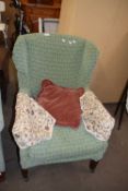 Green loose covered easy chair