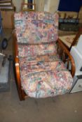 A conservatory armchair and loose cushions