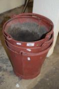 Three red metal buckets