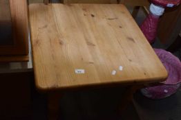 A square pine coffee table