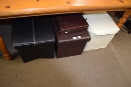 Three leatherette upholstered storage stools and a briefcase
